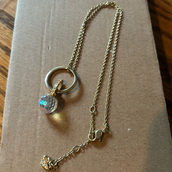 Swarovski Jewelry - Swarovski circle crystal gold tone necklace swan